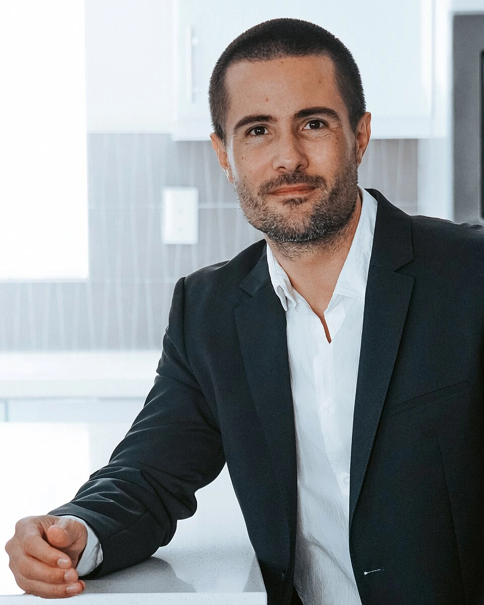 Michael Valdes in a suit portrait-style photo