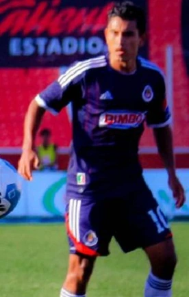 Alberto Medina in a Chivas soccer uniform on the field